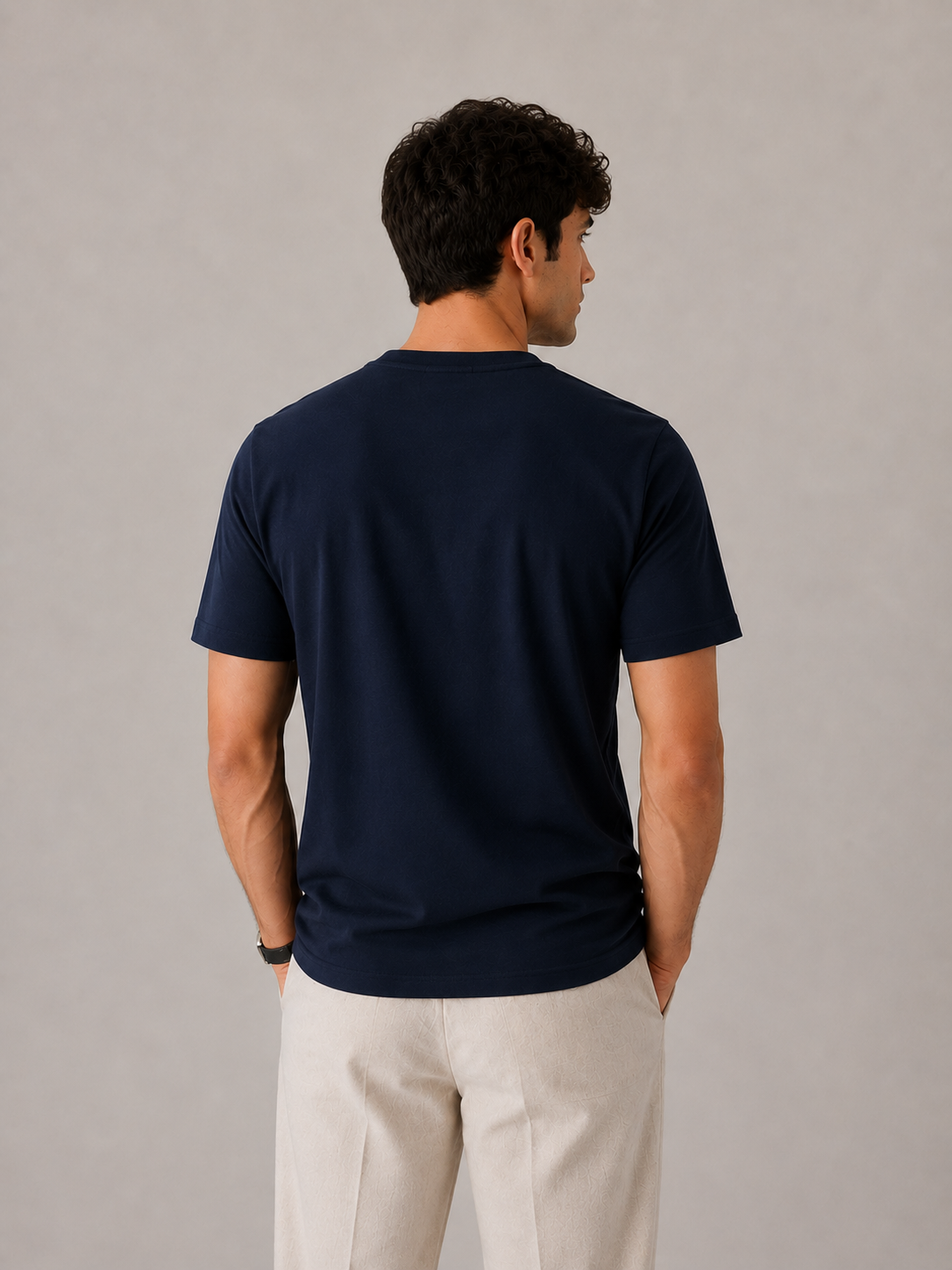 Men's navy blue crew neck t-shirt, back view showing clean shoulder seams and flat hem