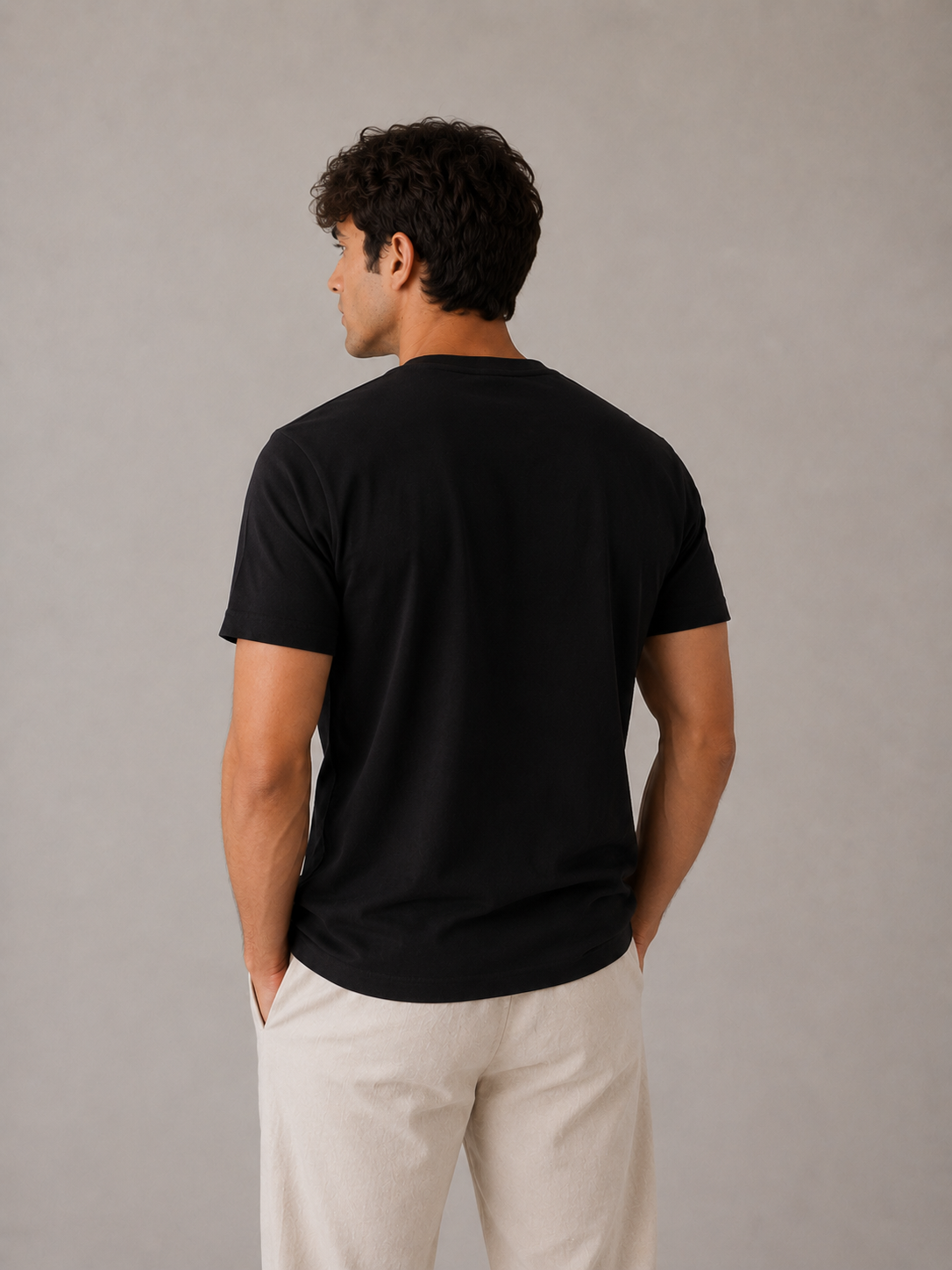 Men's black crew neck t-shirt, back view showing structured shoulder construction