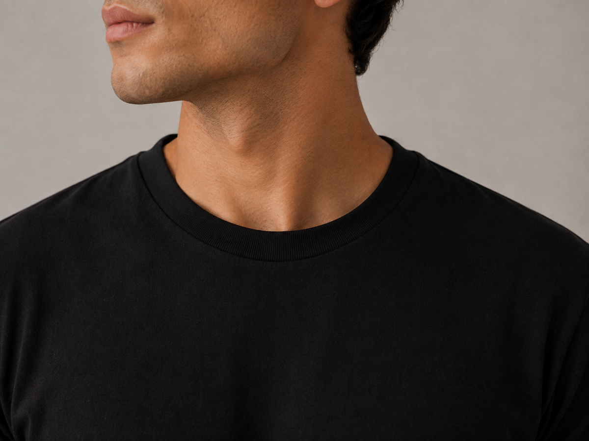 Men's black crew neck t-shirt, close-up view of stay-flat crew collar neckline