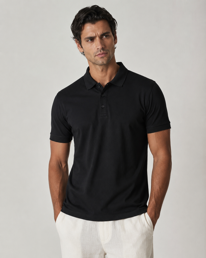 Men’s black Cotton Airtex polo shirt, front view on model, structured anti-curl collar